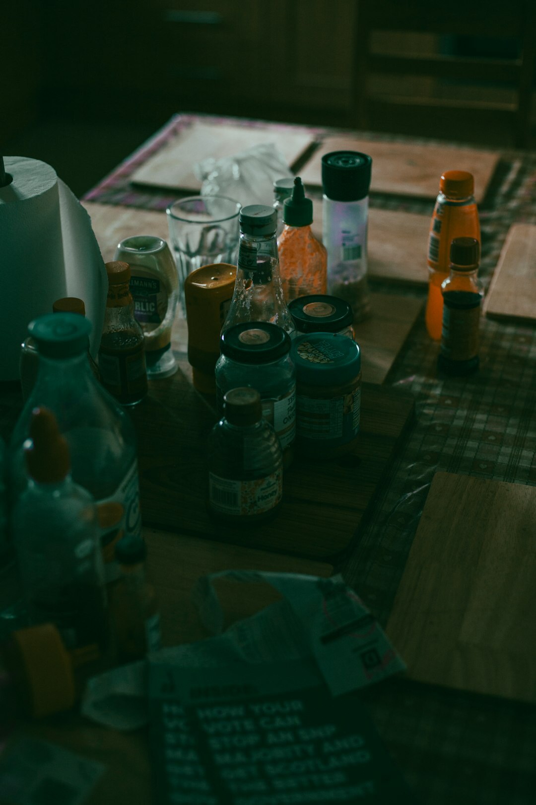 Vintage photographic prints and film rolls spread on a wooden table
