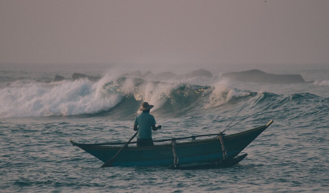 fisherman on wooden boat